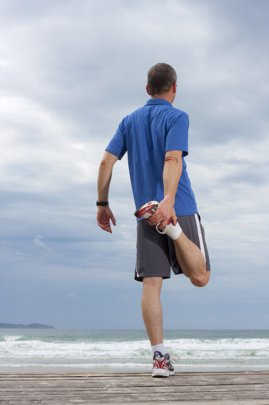 Runner doing stretching exercise exercise